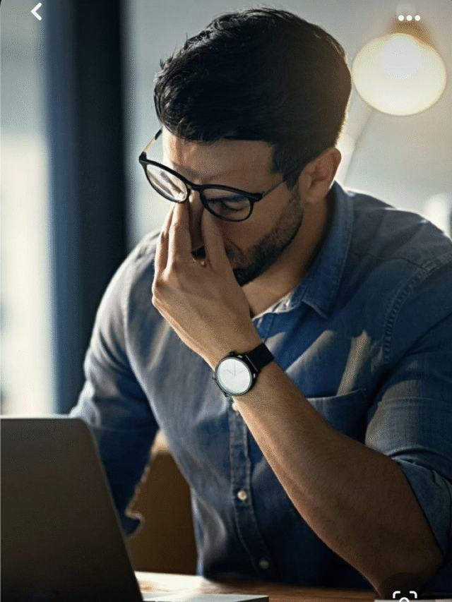 Stressed man at laptop