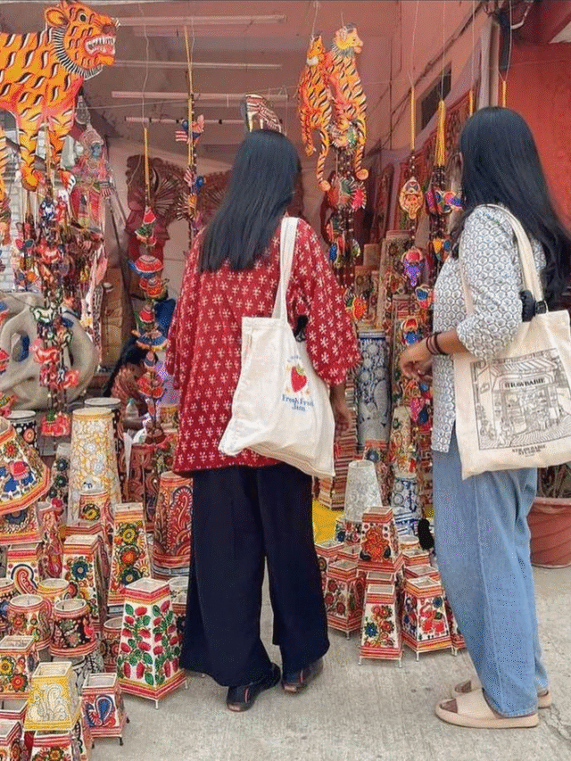 Women at handicraft stall.