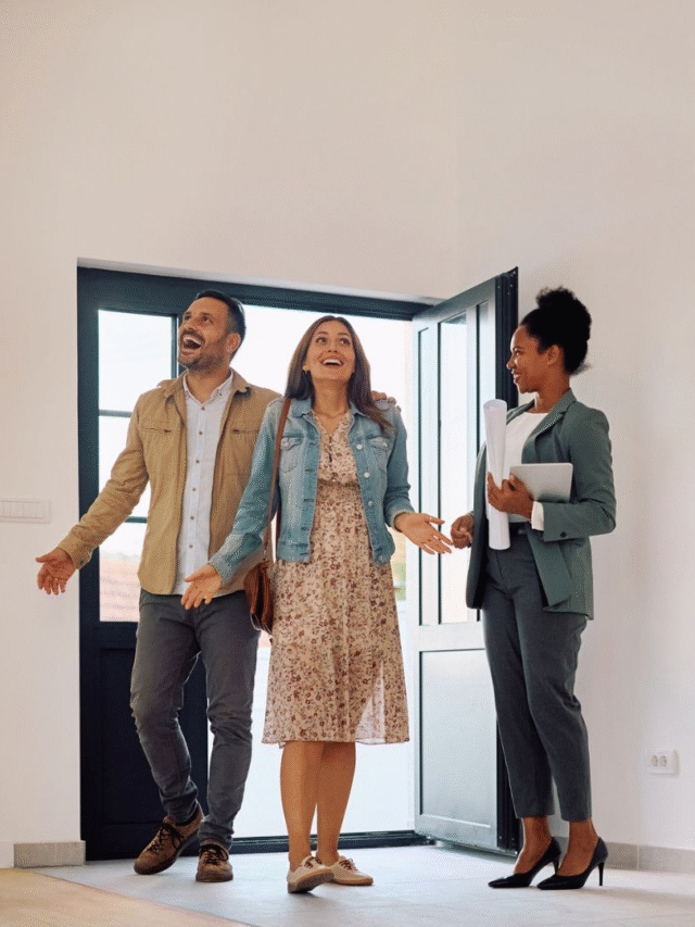 Couple viewing new home with agent