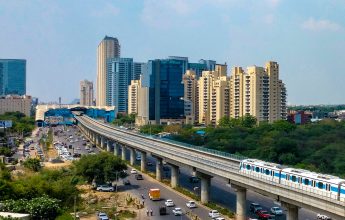 Modern apartments with Delhi Metro and city road view