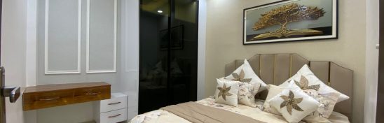 Compact 3 BHK flat interior with kitchen, living room, and bedroom