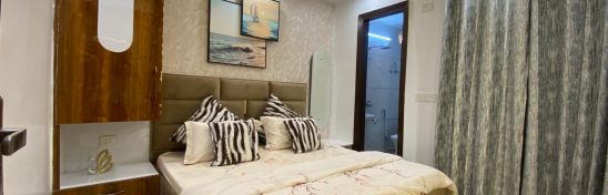 3 BHK flat bedroom with modern decor.