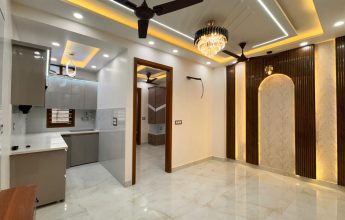 Modern living space with chandelier and modular kitchen