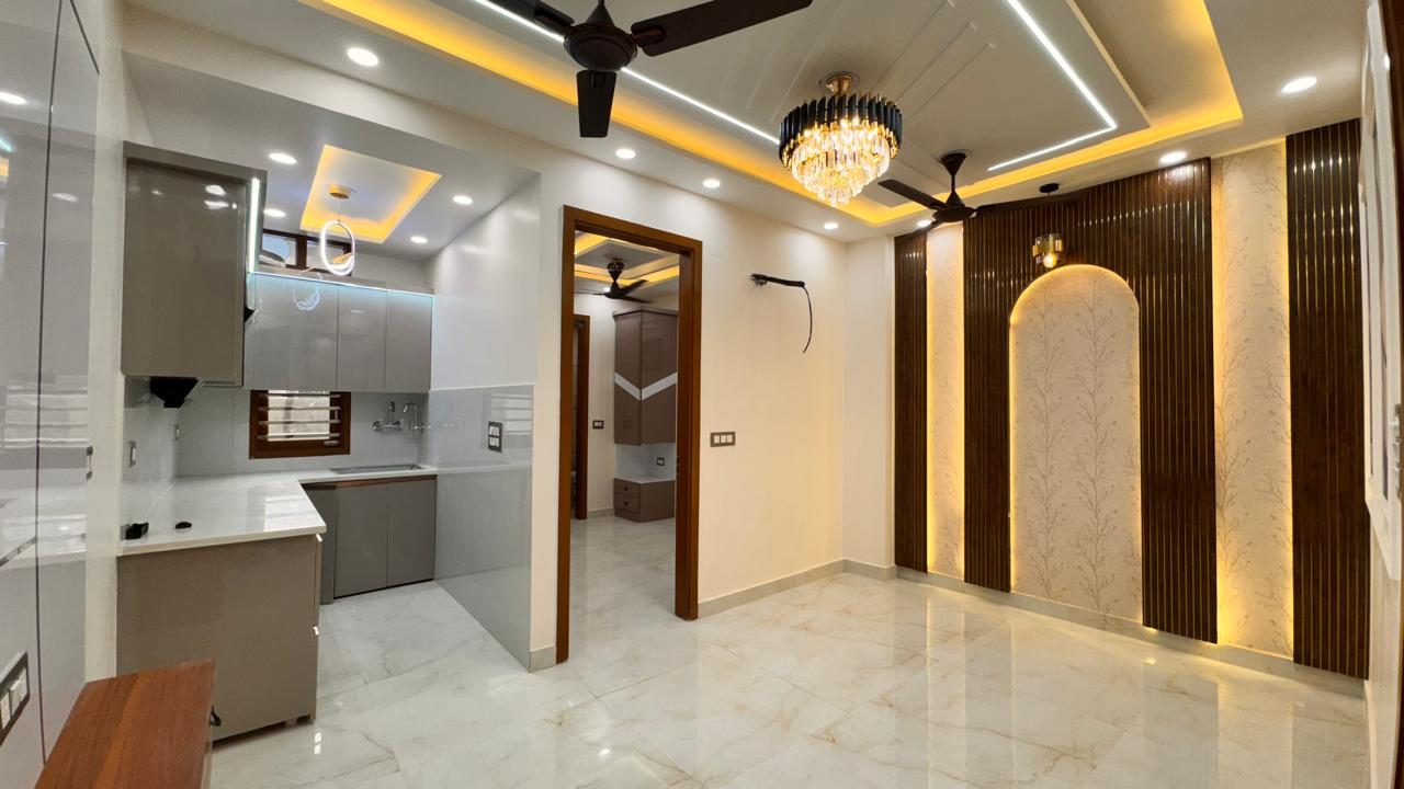 Modern living space with chandelier and modular kitchen