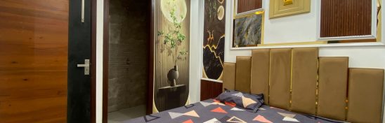 Modern bedroom with artistic wall panel and cozy bed