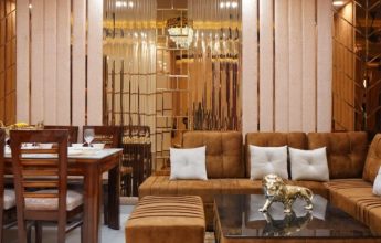 Luxury living and dining area with brown sofa.