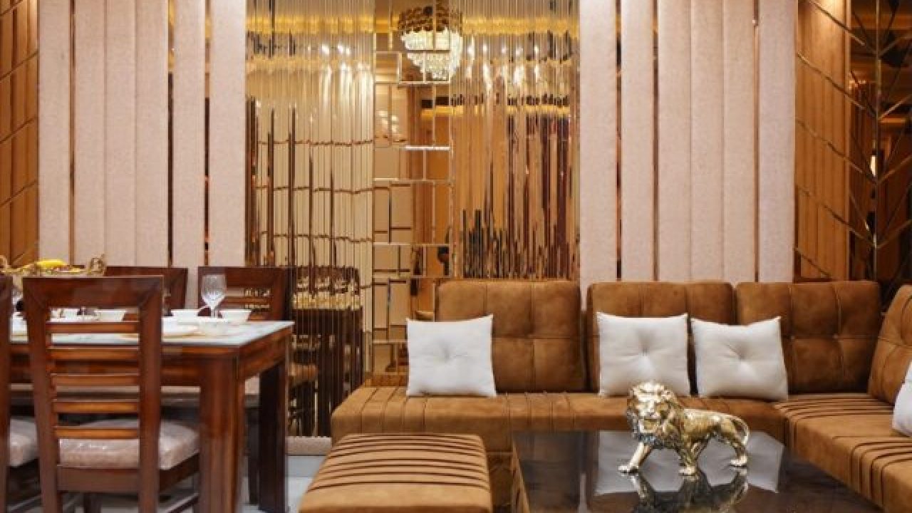 Luxury living and dining area with brown sofa.