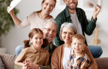 Happy family under roof frame