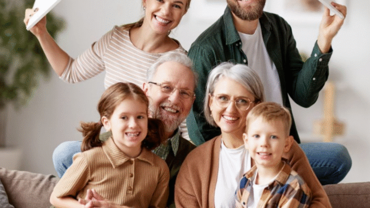 Happy family under roof frame