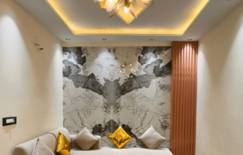Stylish living room with chandelier and marble accent wall