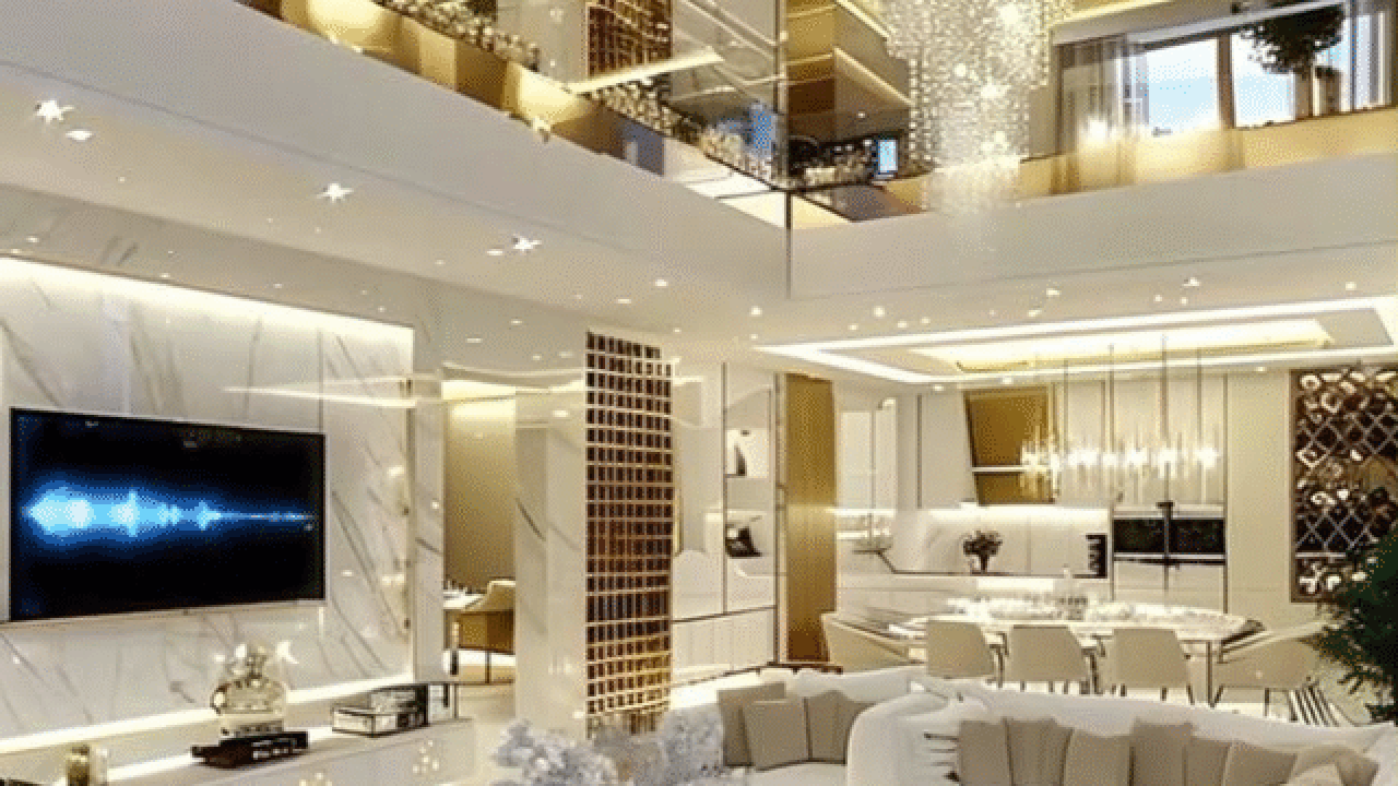 Modern living room with elegant lighting, plush seating, and a chandelier.