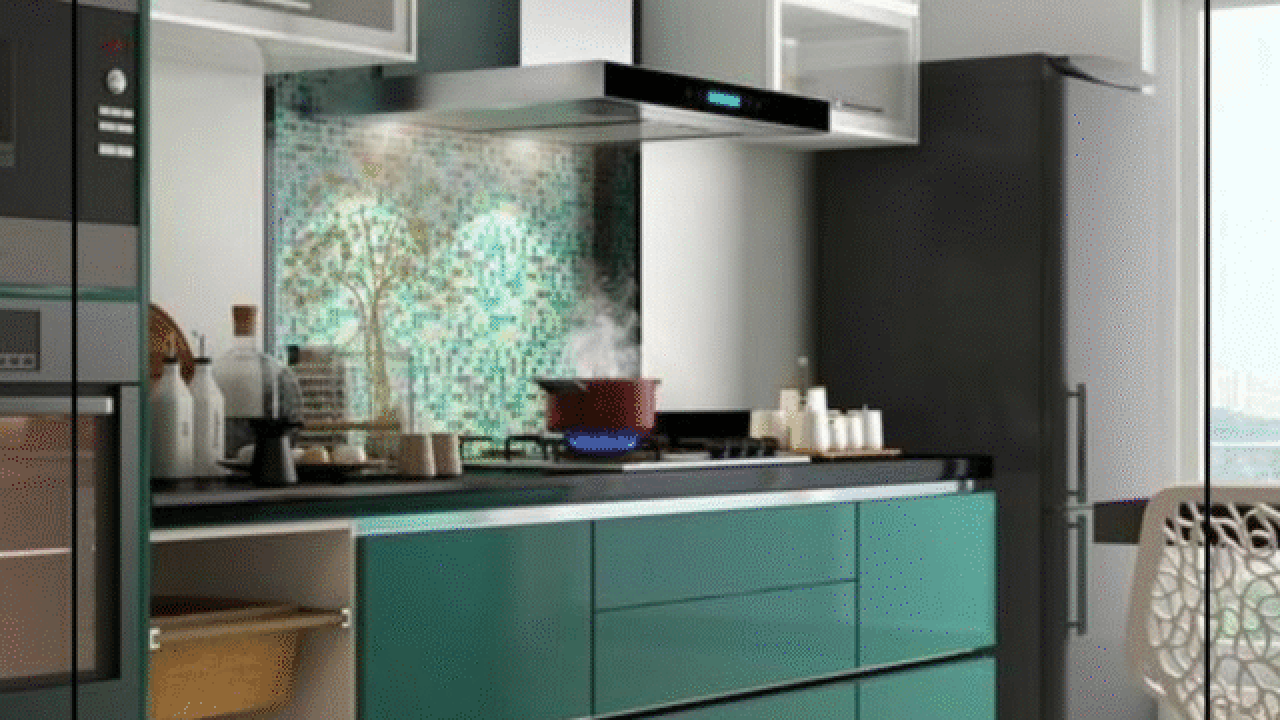 Modern modular kitchen with green cabinets and mosaic backsplash.