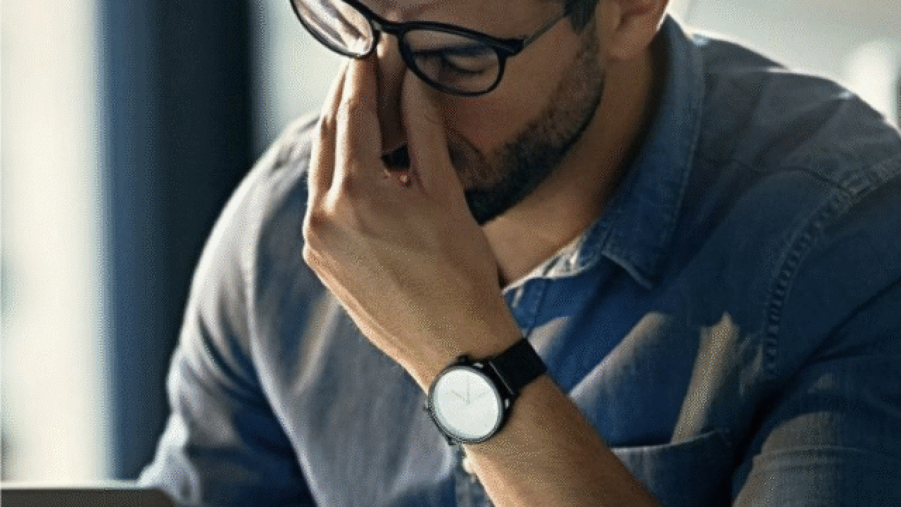 Stressed man at laptop