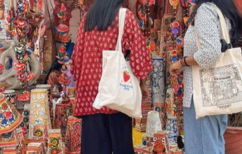 Women at handicraft stall.