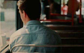 Man sitting alone on bus