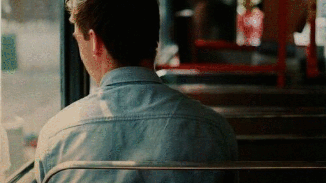 Man sitting alone on bus