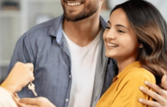 Happy Couple Receiving New Home Keys