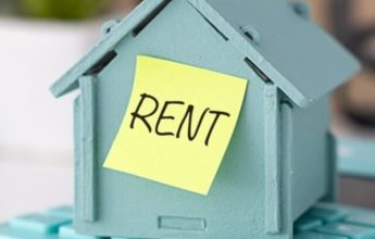 Model,House,Placed,On,Calculator,And,Sticker,Text,Rent.,The