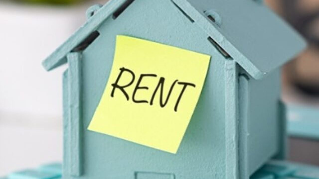 Model,House,Placed,On,Calculator,And,Sticker,Text,Rent.,The